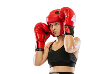 Half-length portrait of professional female boxer in sports protective equipment posing isolated on...