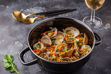 Shells vongole venus clams with vegetables and herbs