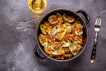 Shells vongole venus clams with vegetables and herbs