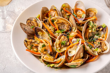 Shells vongole venus clams with vegetables and herbs