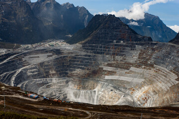 The Grasberg open mine pit in Papua, Indonesia at 4000 metres with the mountains in the background