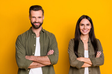 Photo of young cheerful lady guy folded hands smart agent manager isolated over yellow color background
