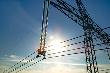 High voltage insulation string on steel pillar with electric power lines for safe delivering of...