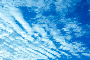 Clear blue sky with white clouds. Beautiful nature background.