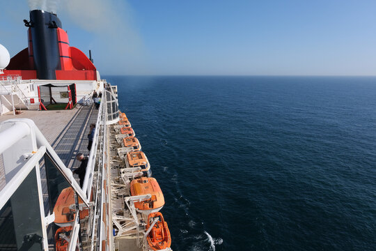 Fototapeta View from open decks of legendary luxury ocean liner  cruise ship on sunny day twilight sunset passage during Transatlantic Crossing from Southampton to New York