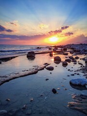 Fototapeta na wymiar water reflection sea sunset beach sunrise shore sunsets golden hour beach landscape