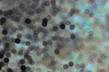 Beautiful glistening abstract bokeh in blue and green.