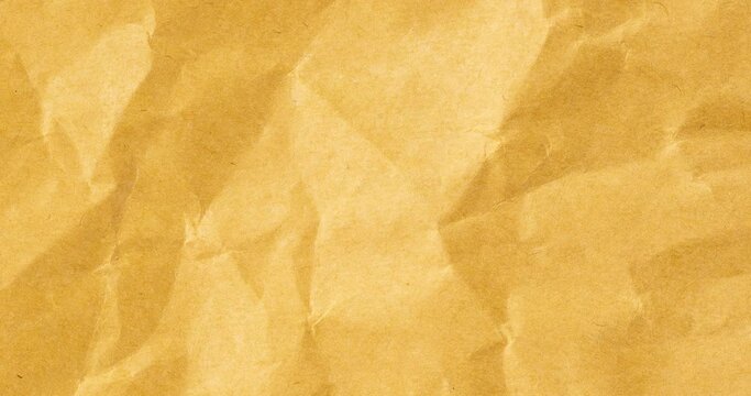 Wrinkled sheet of yellow paper. Textured backdrop