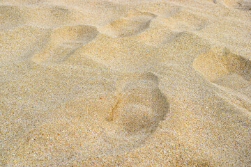 Fototapeta na wymiar Footprints on the beautiful beach sand