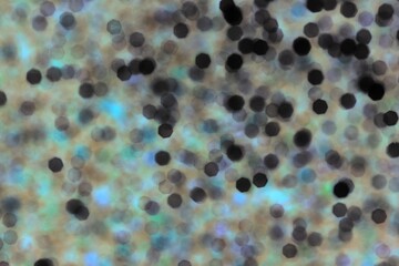 Beautiful glistening abstract bokeh in blue and green.