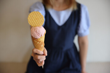 Young woman hand with holding ice cream cone - 508459386