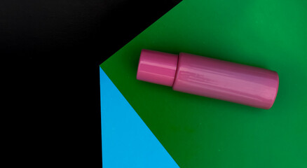 An object in geometric space. Cosmetics, pink perfume bottle. Abstraction and minimalism. Creative composition.