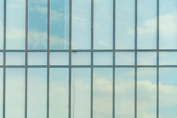 Glass facade of a modern building. Construction and rental housing.