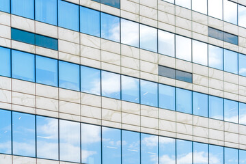 Fototapeta na wymiar Glass facade of a modern building. Construction and rental housing.