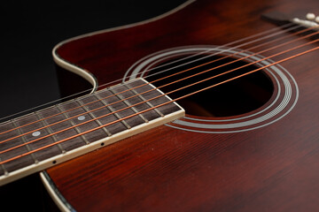 Fototapeta na wymiar Guitar details on black background