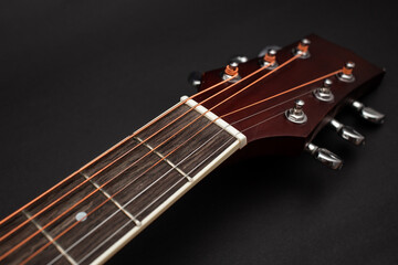 Fototapeta na wymiar Guitar details on black background