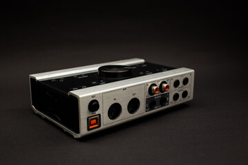 Fototapeta premium Audio mixer on a black background, a subject shot of musical instruments