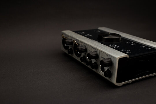 Audio mixer on a black background, a subject shot of musical instruments
