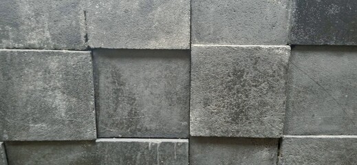 3D square textured stone black wall.