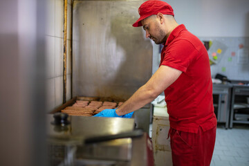 The work of a butcher in a butcher shop.