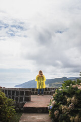 person with an yellow jacket with a view, Azores