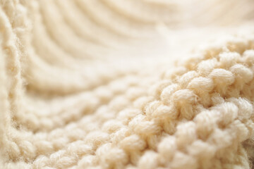 closeup beige knitted woolen fabric texture background - obrazy, fototapety, plakaty