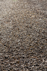 Rough cobble or pebble surface of a walking path of small road. Simple texture surface.