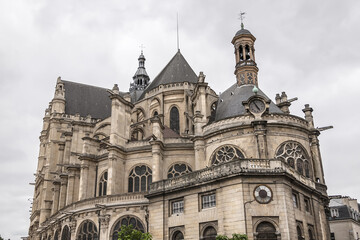 Fototapeta na wymiar Architectural fragments of Paris Saint-Eustache church (Eglise Saint Eustache, 1532 - 1637). Saint-Eustache church located in Les Halles area of Paris. UNESCO World Heritage Site. Paris, France.