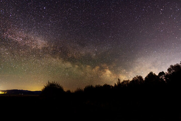 Beautiful bright milky way galaxy at the night sky. Astronomical background.