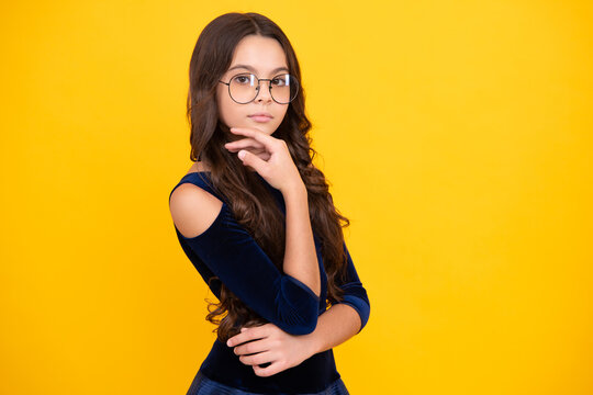 Cute preteen girl head shot. Child portrait on isolated background. Beautiful teenager face.