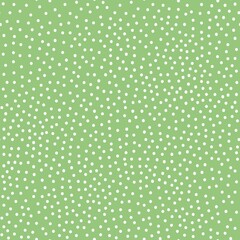 A simple pattern is abstract . small white dots. green background. Fashionable print for textiles, wallpaper and packaging.