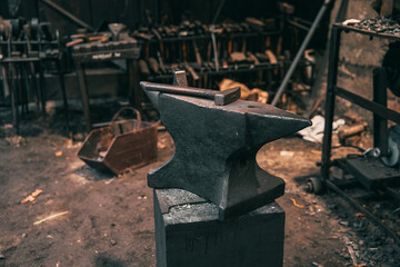 Close up of an anvil in an old blacksmith workshop. Concept of hardworking craftsmanship.