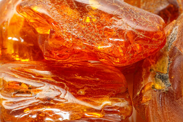 Luxury modern amber background. Natural mineral. Material for jewelry and ornaments. Sun stone. Science and geology. Fossilized resin. Semi-precious crystal