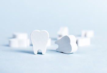 White beautiful teeth on blue background. Dental care, stomatology, dentist work, plaque, cavity...