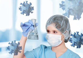 Scientist researches concept. Covid-19 samples in test tubes of virologist. Biologist is studying...
