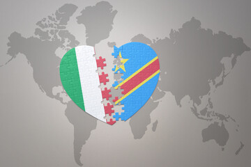 puzzle heart with the national flag of democratic republic of the congo and italy on a world map background. Concept.
