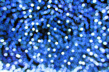 Blurred blue light bokeh background. Abstract art of lighting blur wallpaper at festival. Defocus concept.