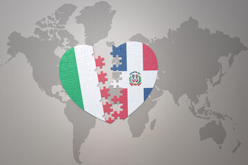 puzzle heart with the national flag of dominican republic and italy on a world map background. Concept.