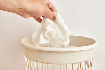 The medical bandage is discarded for disposal and recycling.