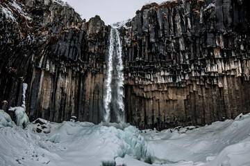 Fototapeta na wymiar Iceland - icicles on the waterfall, Skaftafell