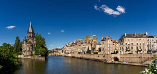 panorama of the Moselle River and Moyen Bridge with the historic city center of Metz behind
