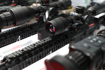 Detail view of the military scope mounted on a automated rifle optical part of a military weapon. Army weapons industry.