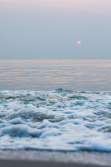 Bubbles on golden beach with ocean water in the morning at Thailand beaches.