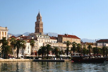 Fototapeta premium Promenade in Split, Croatia with landmark architecture and sailing boats.
