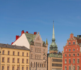 Old 1700s houses and the German church in the old town Gamla Stan an evening sunny summer day in Stockholm