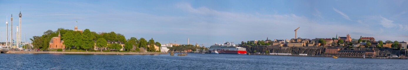Panorama view over the bay Stockholms Ström in evening light with the district Södermalm and...