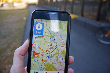 18: Travel concept - tourist with of line map on the smartphone in Berlin