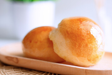 Close up two butter bread bun  on wooden plate
