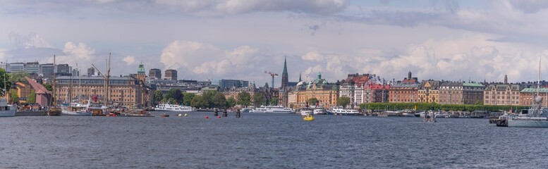 Panorama view with boats, piers, office buildings and hotels in the bay Ladugårdsviken a sunny day...