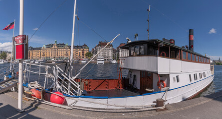Old steam commuting boat Enköping at the bay Nybroviken a sunny day in Stockholm